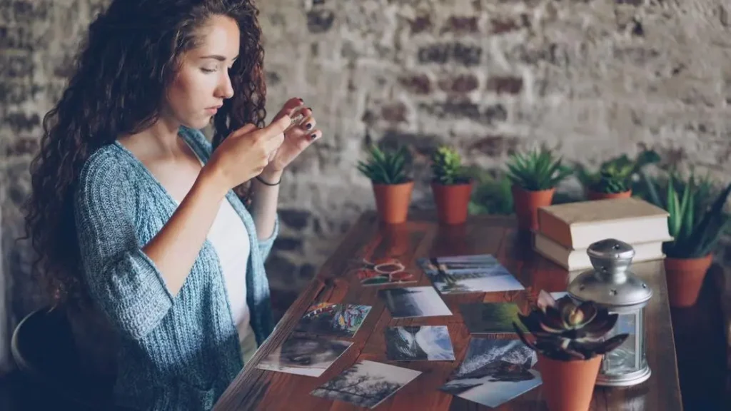 Woman reviewing photos and reflecting on how to know if you have forgiven someone